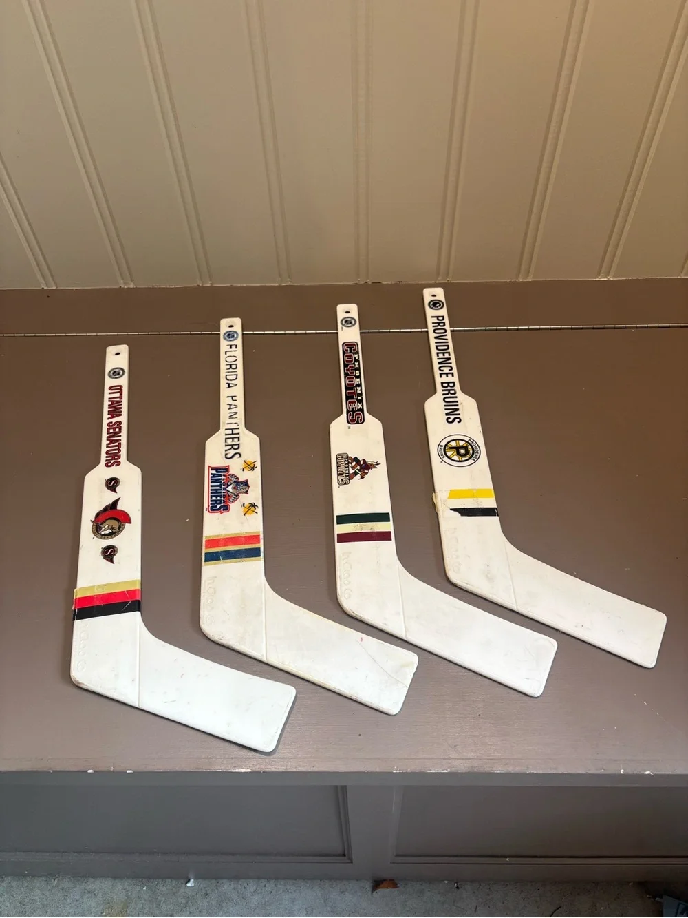 Vintage White Hockey Goalie Stick Wall Set with Team Decals